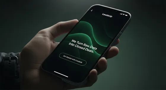 A hand holding a phone showing the LeadsUp screen: We Turn Raw Data Into Closed Deals